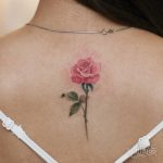 Pink rose tattoo on the back
