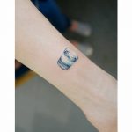 Realistic glass of water tattoo