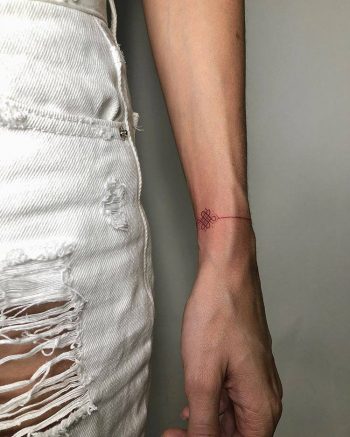 Red bracelet tattoo by ann pokes