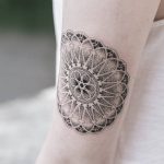 Rose window themed geometric mandala tattoo
