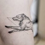 Running wolf tattoo
