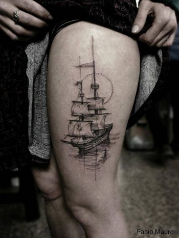 Sailing ship tattoo on the thigh