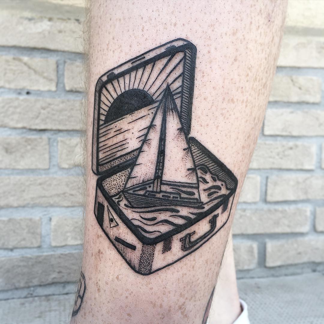 Ship in a suitcase tattoo