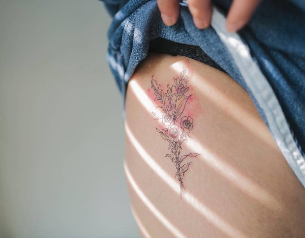 Sketch style flower bouquet tattoo