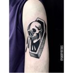 Skull and coffin tattoo