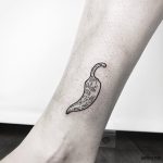 Small chilli pepper tattoo on the ankle