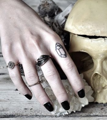 Small crystal tattoo on the index finger