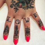 Small ornament tattoos on fingers