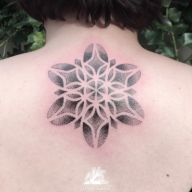 Snowflake mandala tattoo on the back 