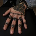 Snowflake tattoos on fingers