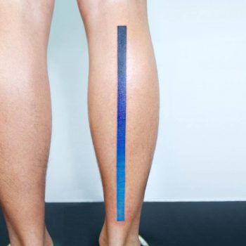 Spectrum line tattoo on the right calf