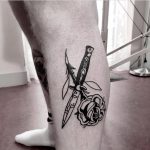 Switchblade and rose tattoo on the calf