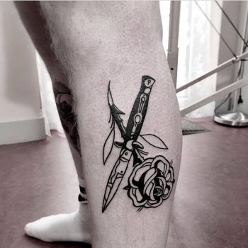 Switchblade and rose tattoo on the calf