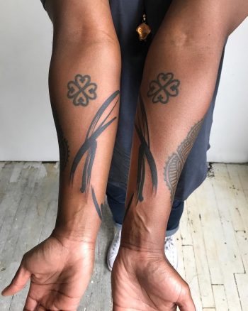 Symmetrical brushstrokes tattoos
