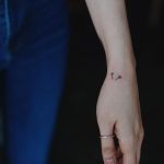 Tiny arrows tattoo on the hand
