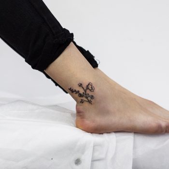 Tiny blueberry and jasmine tattoo