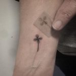 Tiny four leaf clover tattoo