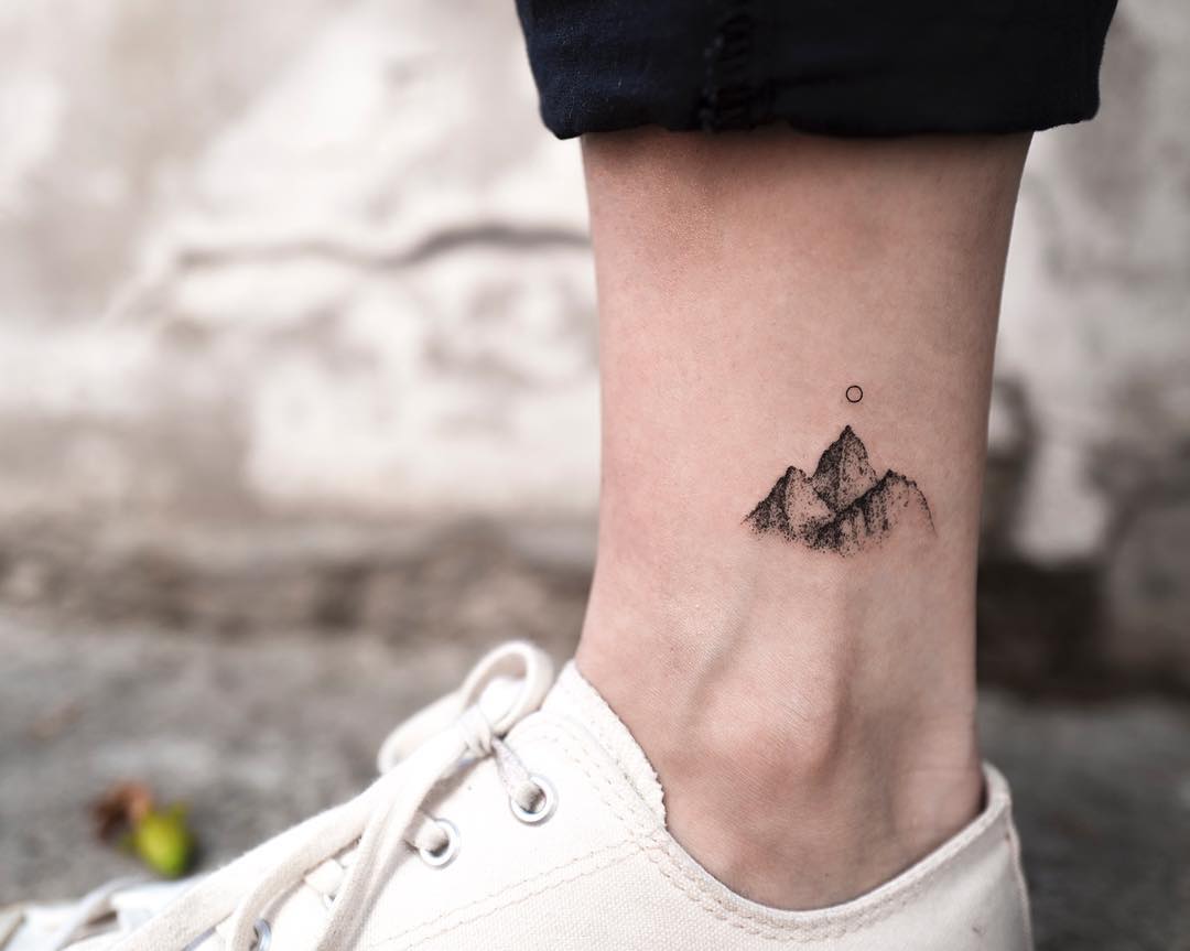 Tiny mountain tattoo on the ankle