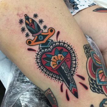 Traditional dagger, heart, and flower
