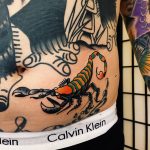 Traditional scorpion tattoo on the belly