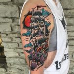 Traditional ship and squid tattoo
