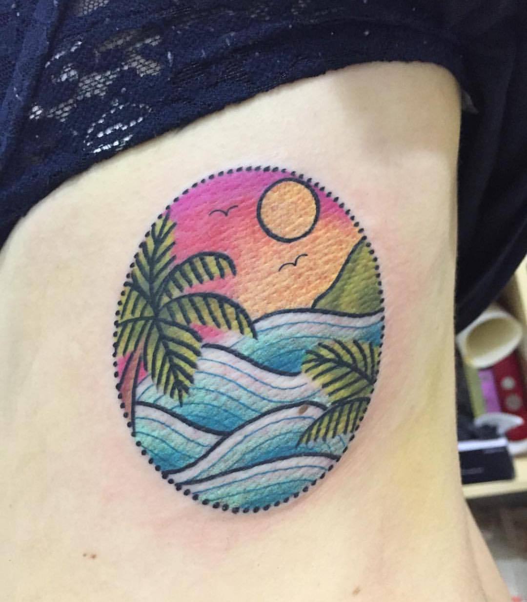 Tropical landscape tattoo on the rib