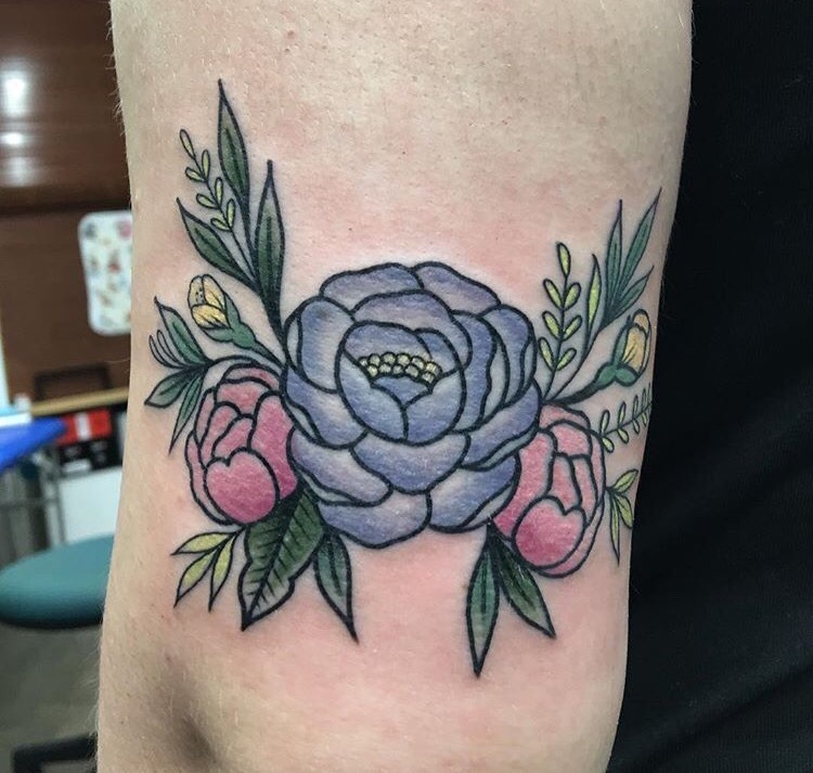 Violet and pink rose tattoo on the arm