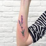 Watercolor lavender tattoo on the forearm