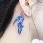 Watercolor fish tattoo on the neck