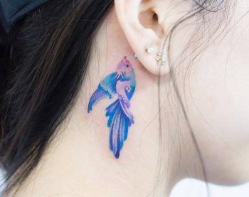 Watercolor fish tattoo on the neck