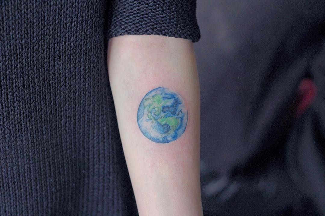 Watercolour earth tattoo