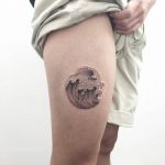 Wave tattoo on the thigh