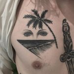 Waves, palm tree and eyes tattoo