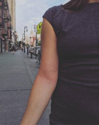 White tattoo of a new york skyline