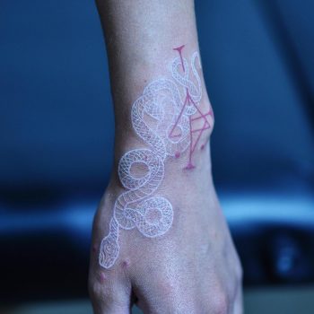 White snake and red ornament tattoo