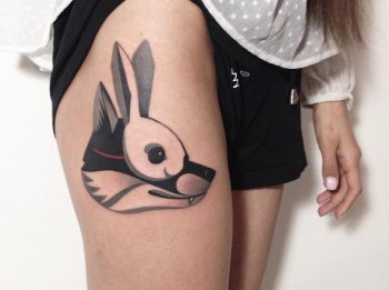 Wolf with a rabbit's mask tattoo