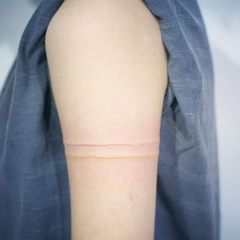 Yellow and red line tattoo