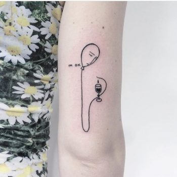 Balloon and vine glass tattoo