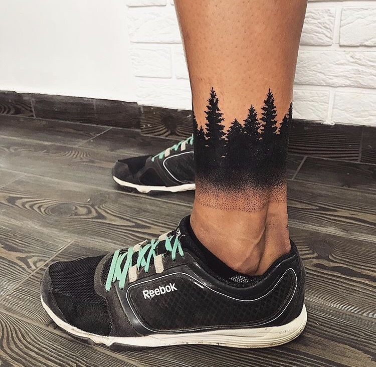 Black forest tattoo on the left ankle