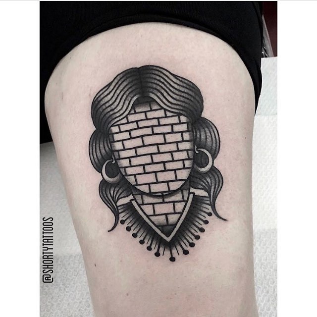 Brickwall face tattoo