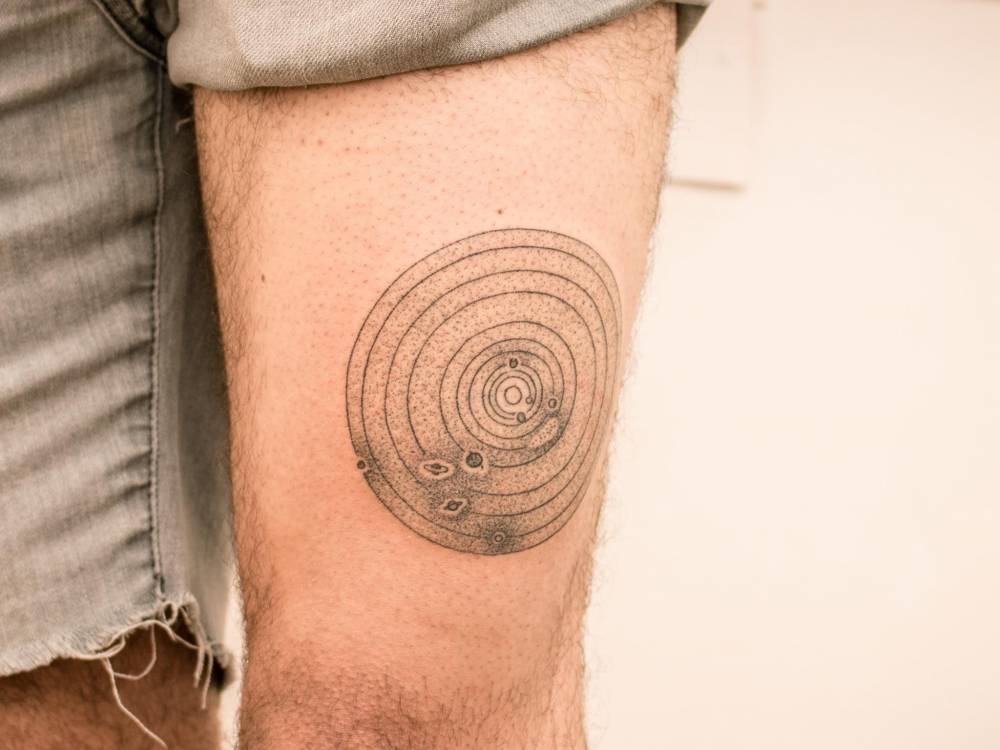 Circular solar system tattoo