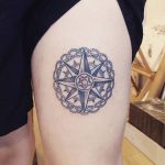 Compass rose on the thigh