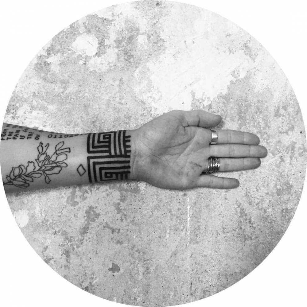 Custom pattern tattoo on the wrist