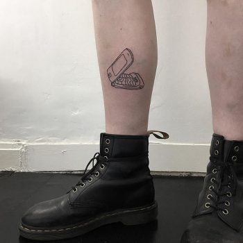 Feature phone tattoo handpoked by zero zero tattoo