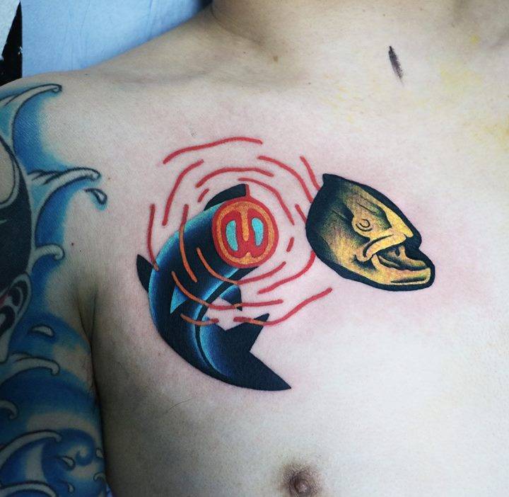 Fish and head tattoo