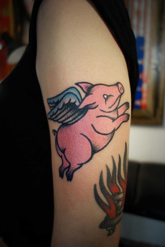 Flying pig tattoo