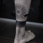 Geometric black mandala and gradient legband tattoo