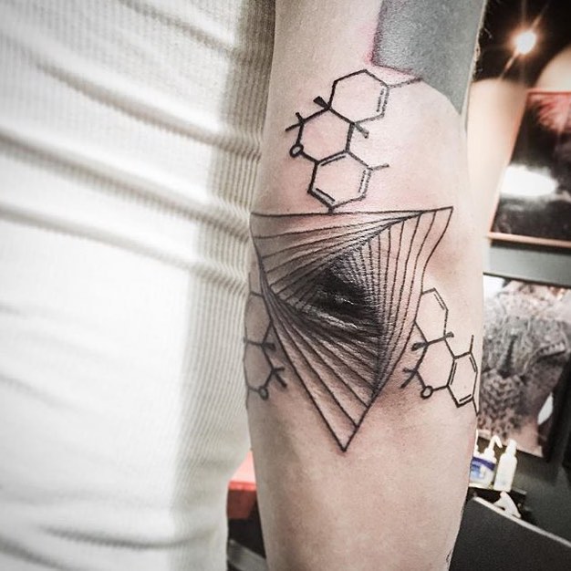 Geometric tattoo on the elbow by unkle gregory