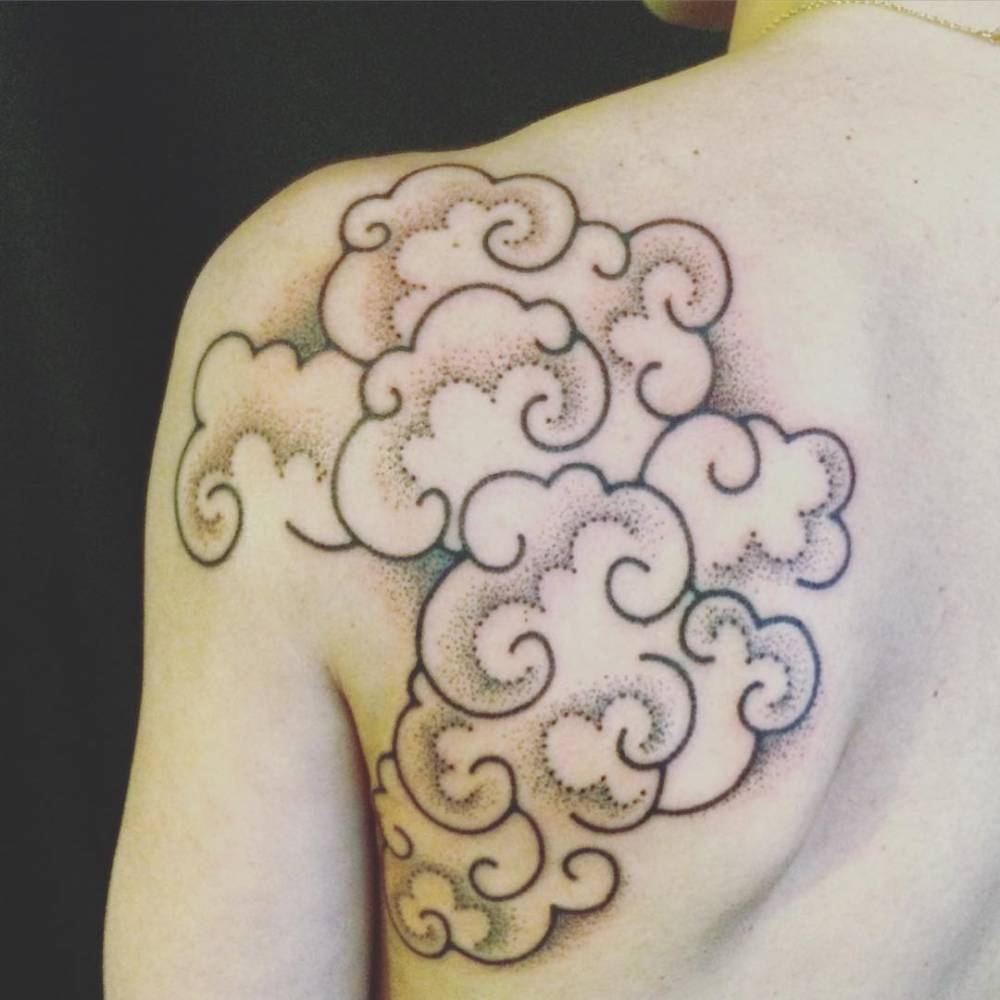 Hand poked cloud tattoo