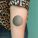Hand poked gradient circle tattoo
